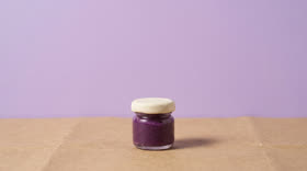 The same clay jar, small and low in a wide frame